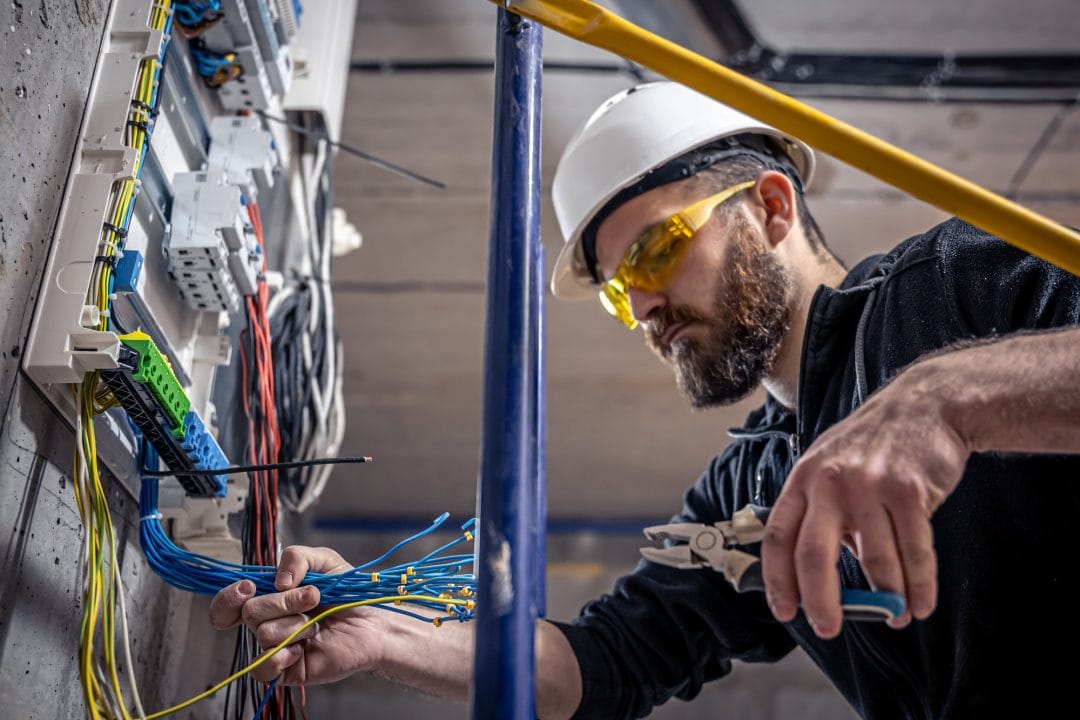 Electrician Working at Electrical Station